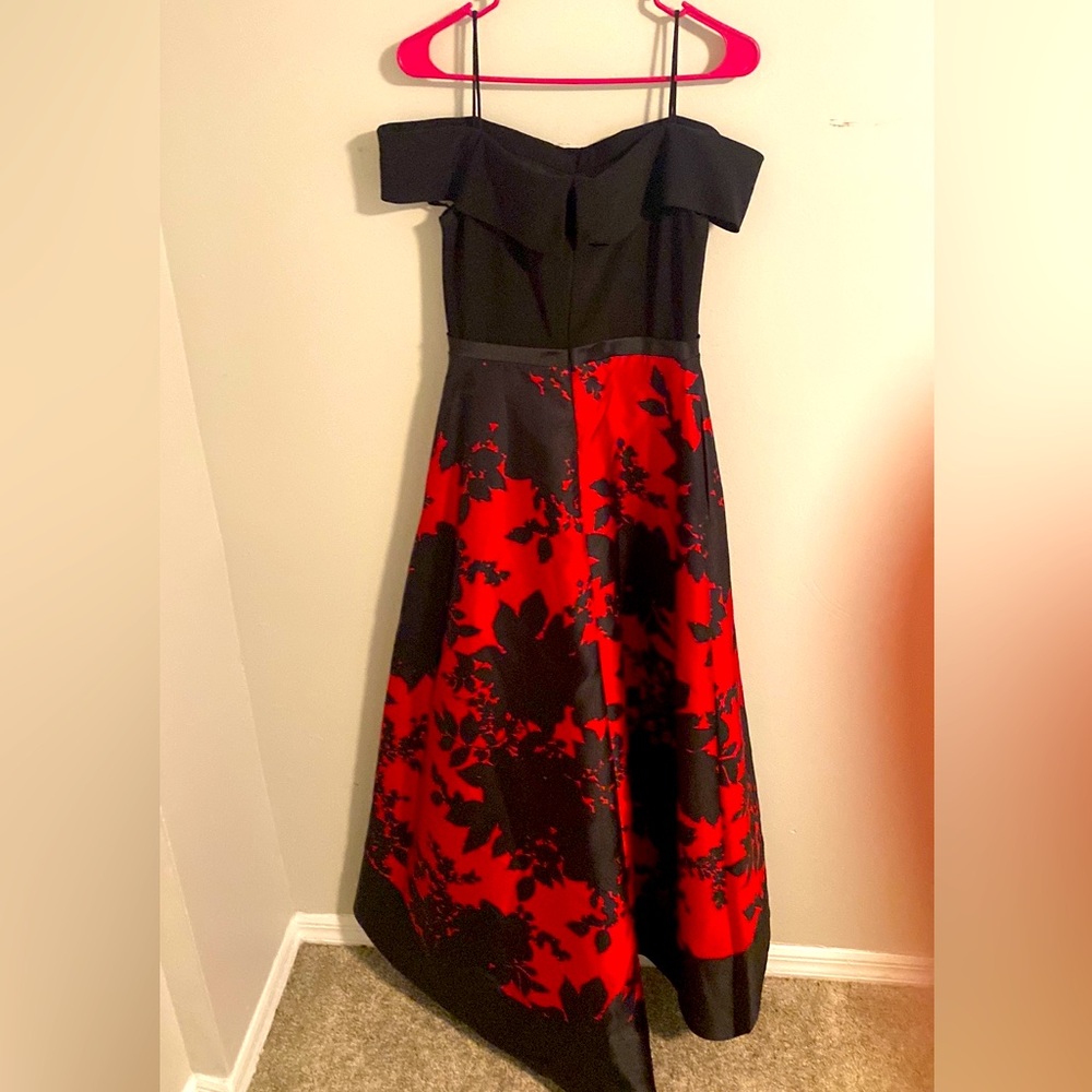 Gorgeous dress with a classic off shoulder , floral print on a satin skirt.